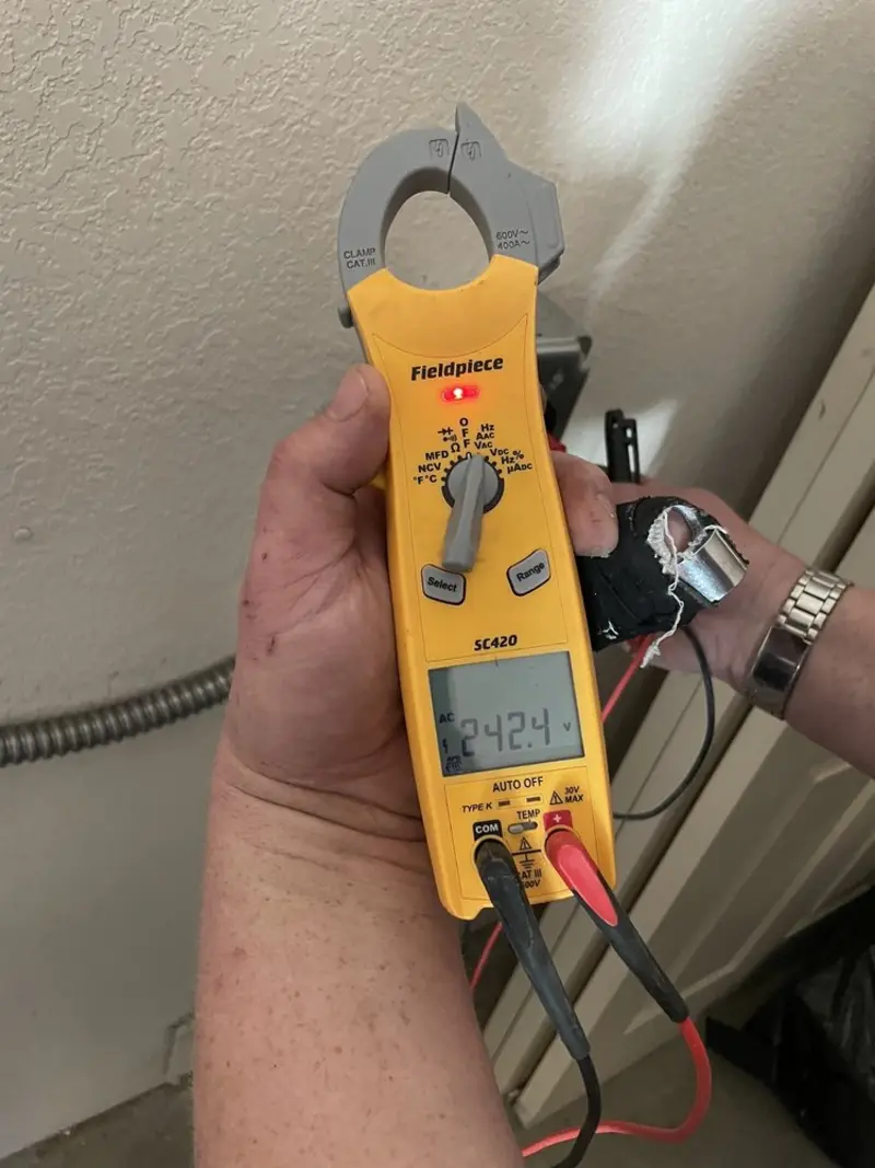 Voltage testing with clamp meter during Electrical Installation Services in Galway